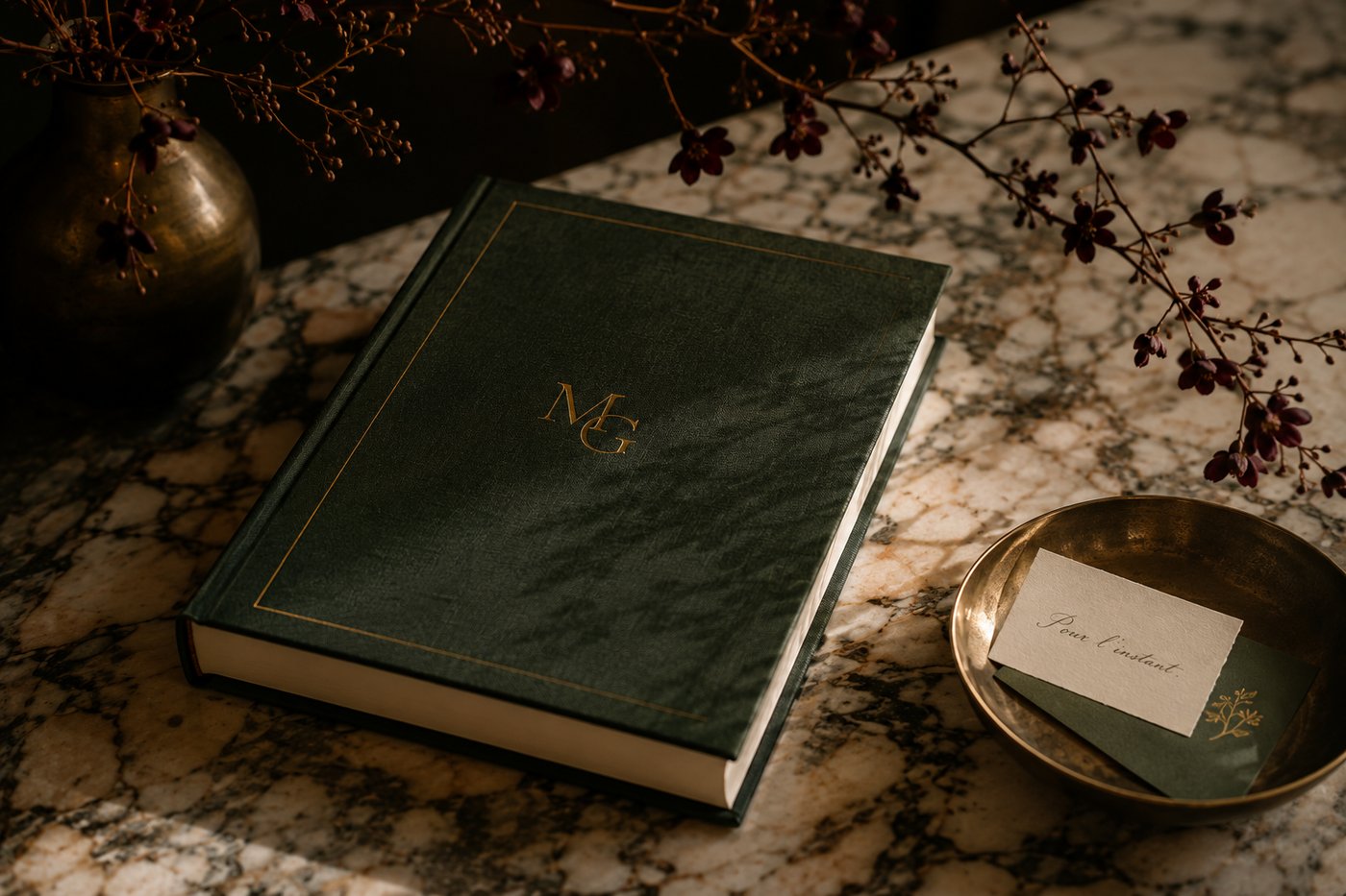 The Maison Grey book, embossed with the MG monogram, on marble